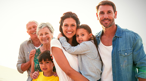 Multi-generation family on beach